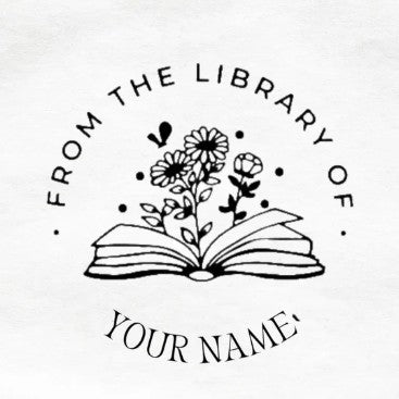 Custom hand embosser and seal clip impression from the library of your name with open book and floral design on paper